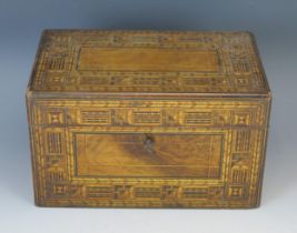 A 19th century parquetry tea caddy of rectangular outline, the hinged lid enclosing two lidded