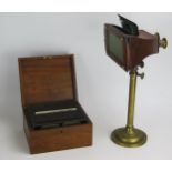 A London Stereoscopic Company Brass and Walnut Viewer with an adjustable telescopic stand, 37-53cm