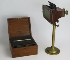 A London Stereoscopic Company Brass and Walnut Viewer with an adjustable telescopic stand, 37-53cm