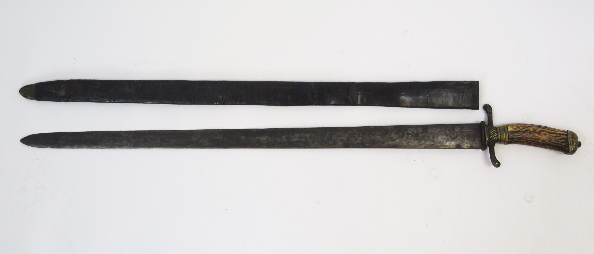 A 19th century continental hunting sword, with 64cm double edged blade, with brass cross guard, - Image 3 of 4