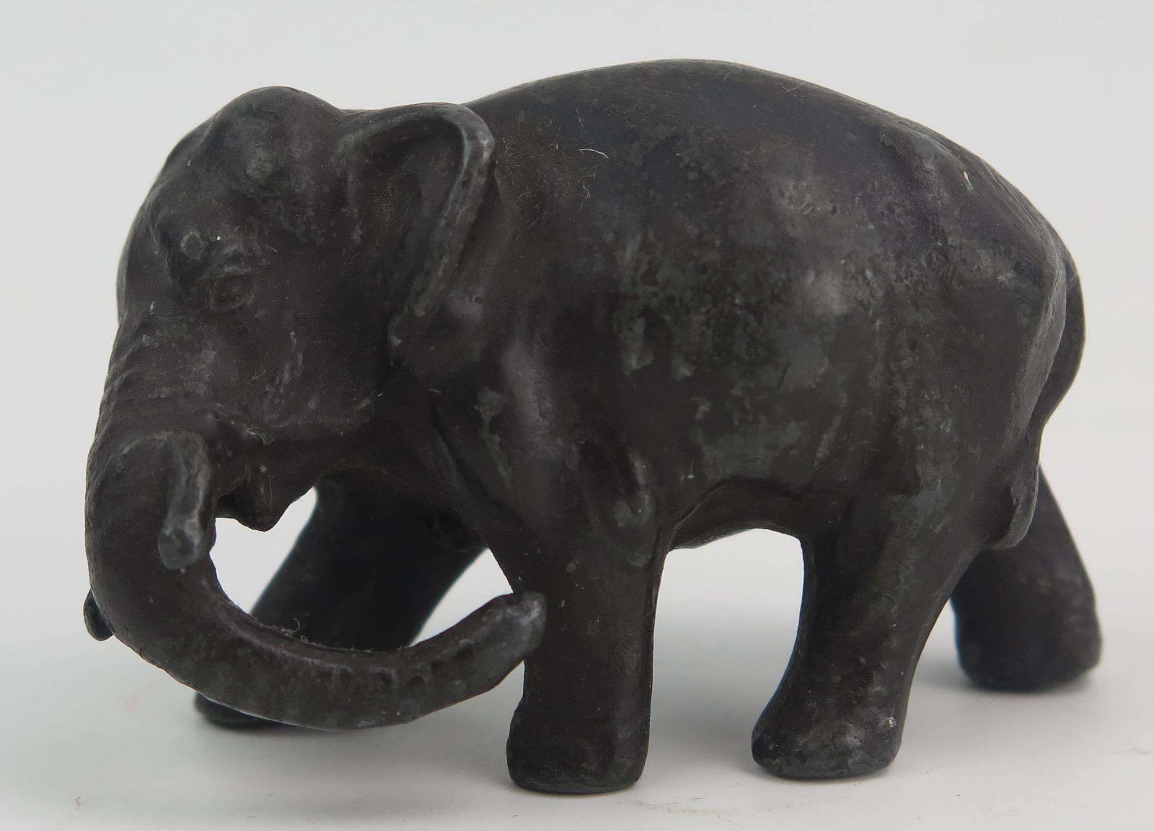 A Japanese Meiji Period Bronze Elephant (12cm long) and on a carved wooden stand and one signed - Image 3 of 3