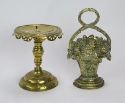 A Victorian brass trivet of circular outline, with pierced top and rim, on a knopped stem and