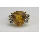 A Citrine and Diamond Dress Ring in a precious yellow metal setting, 12.1x11mm principal stone