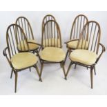 A Set of Six Dark Ercol Dining Chairs including two carvers
