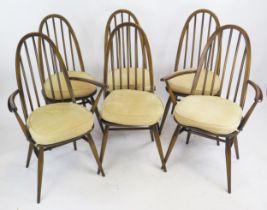 A Set of Six Dark Ercol Dining Chairs including two carvers