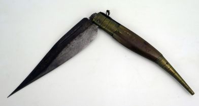 A Spanish Navaja knife, with 22cm single hinged, curved and fullered blade, with horn and brass