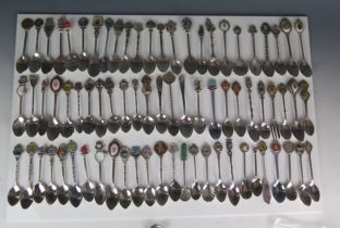 An extensive collection of silver plated souvenir spoons, some with enamelled decoration. (a lot).