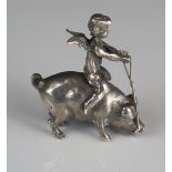 A continental silver model of a cherub riding on the back of a pig, unmarked, 4cm long, 21gms, 0.