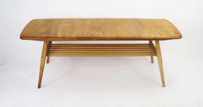 An Ercol Blonde Coffee Table with ,magazine rack below, 103x44cm