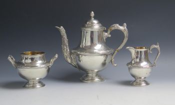 An Edward VII silver three-piece tea service, maker Walker & Hall, Chester, 1906, of baluster form