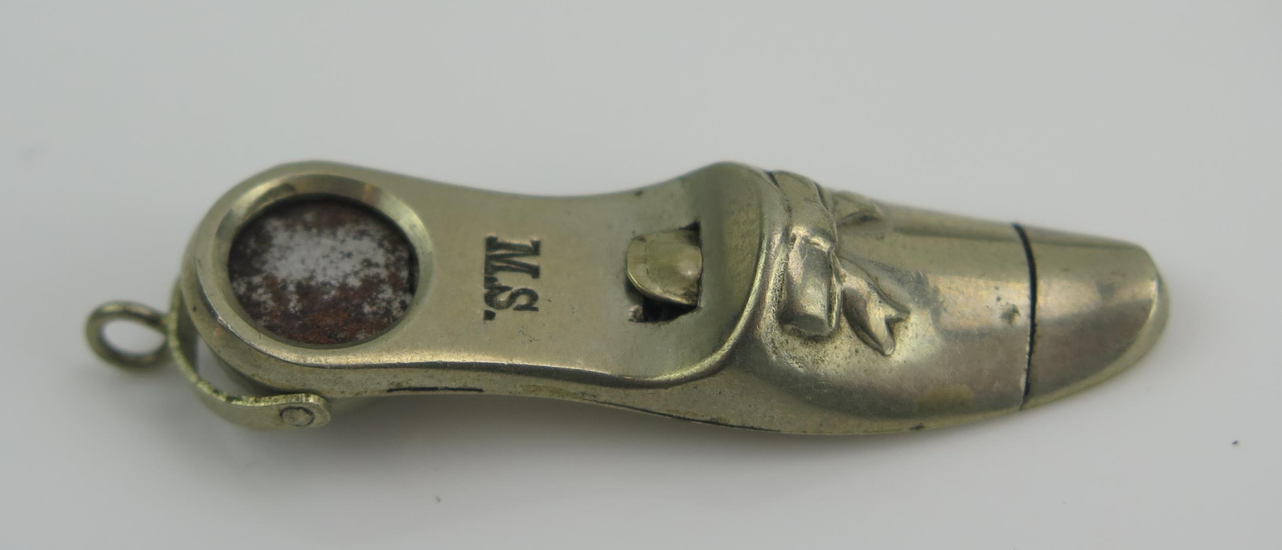 A Halifax Patent Cigar Cutter, a shoe shaped cigar cutter (M.S.), one in the form of a rifle and - Image 2 of 2