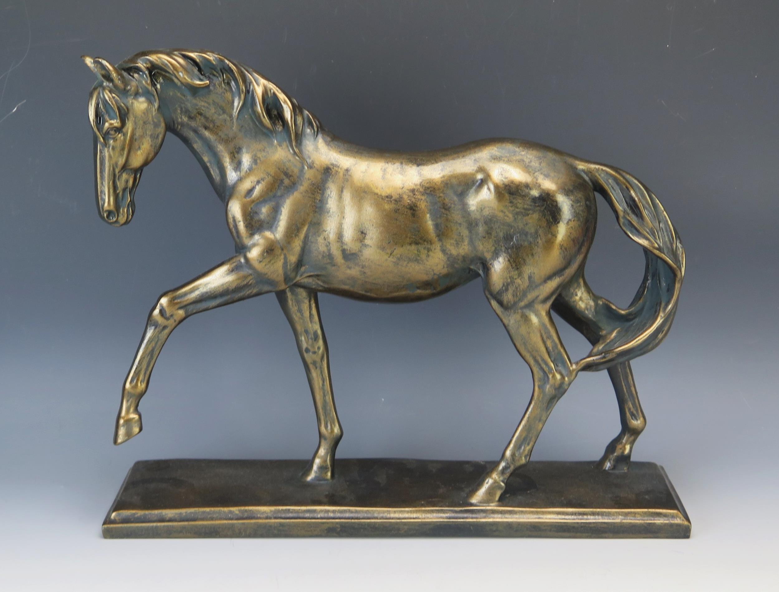 A bronzed resin model of a stallion, on a rectangular plinth base, 41cm long, 34cm high. - Image 2 of 2