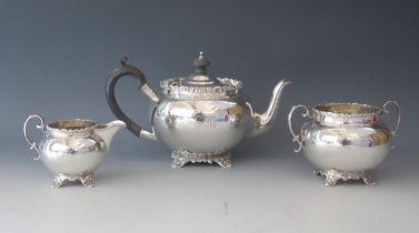 An Edward VII silver three-piece tea service, maker Barker Brothers, Chester 1909, monogrammed, of