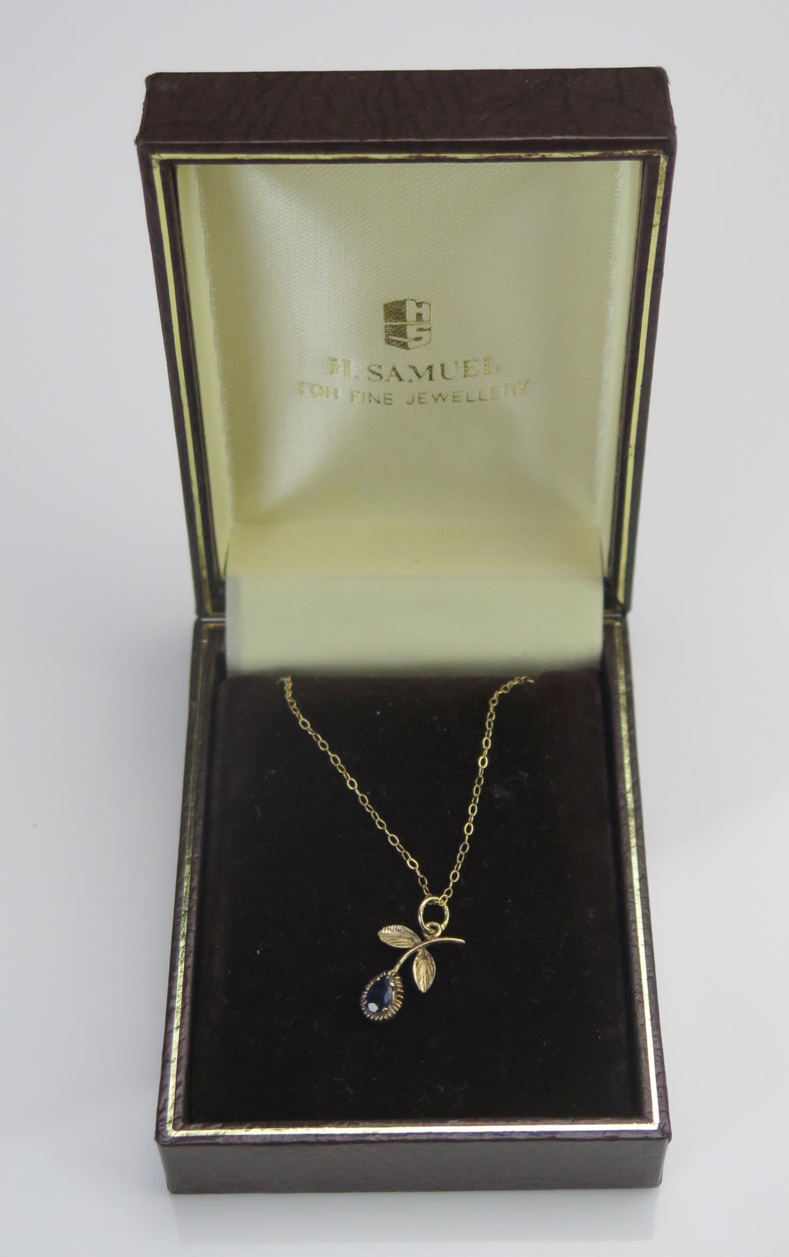 A 9ct Gold and Sapphire Pendant on chain, 18.7mm drop, 9" (23cm), 1.07g), H. Samuel box