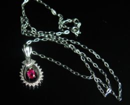 A Modern 18ct White Gold, Ruby and Diamond Pendant on an 18ct chain, 26.8mm drop, c. 5.2x4.27mm