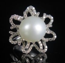 A 18ct White Gold, Pearl or Cultured Pearl and Diamond 'Flower Head' Ring, 11.33mm diam. pearl, 21.