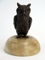 A Bronze Paperweight modelled as an owl and on a hardstone base, 9cm high