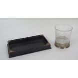 An ebonised and silver mounted dressing table tray, 30cm wide, together with and etched glass and