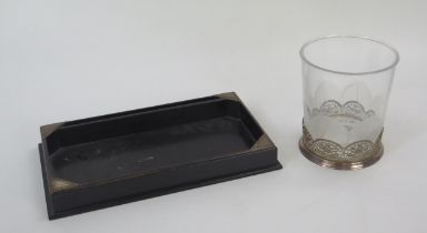 An ebonised and silver mounted dressing table tray, 30cm wide, together with and etched glass and