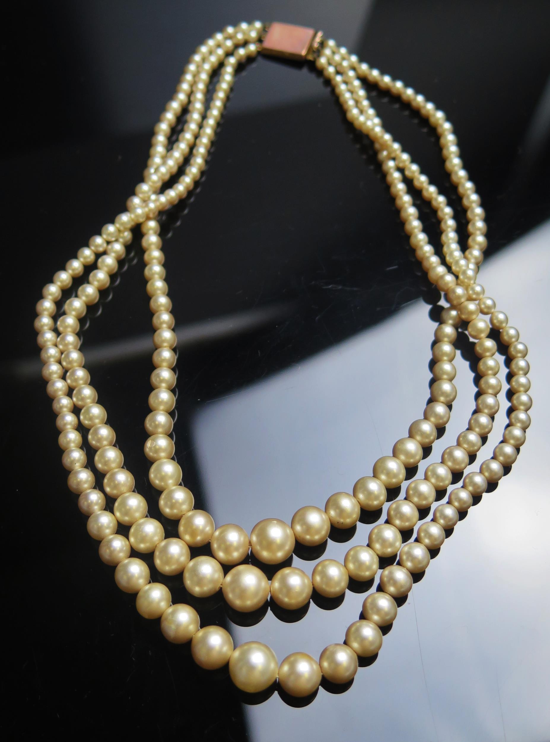 A CIRO Three Strand Synthetic Pearl Necklace with 9ct gold clasp, 14.5" (37cm)