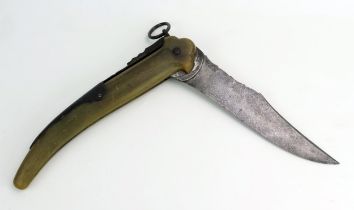 A 19th century French folding hunting knife, the 21cm folding single edged and curved blade