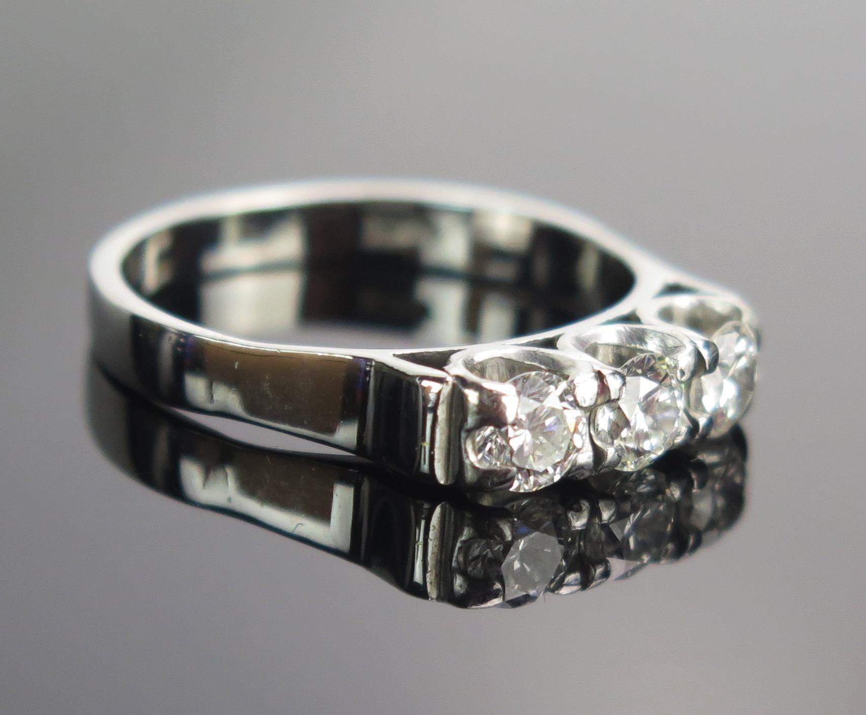An 18ct White Gold and Diamond Three Stone Ring, set with three c. 4.1mm brilliant round cut stones, - Image 2 of 2