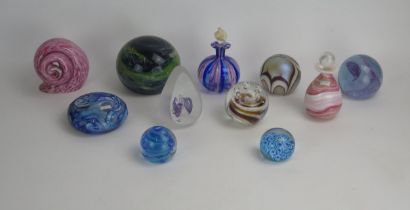 A Collection of Twelve Glass Paperweights and Scent Bottles including Mdina, Gozo and Caithness,