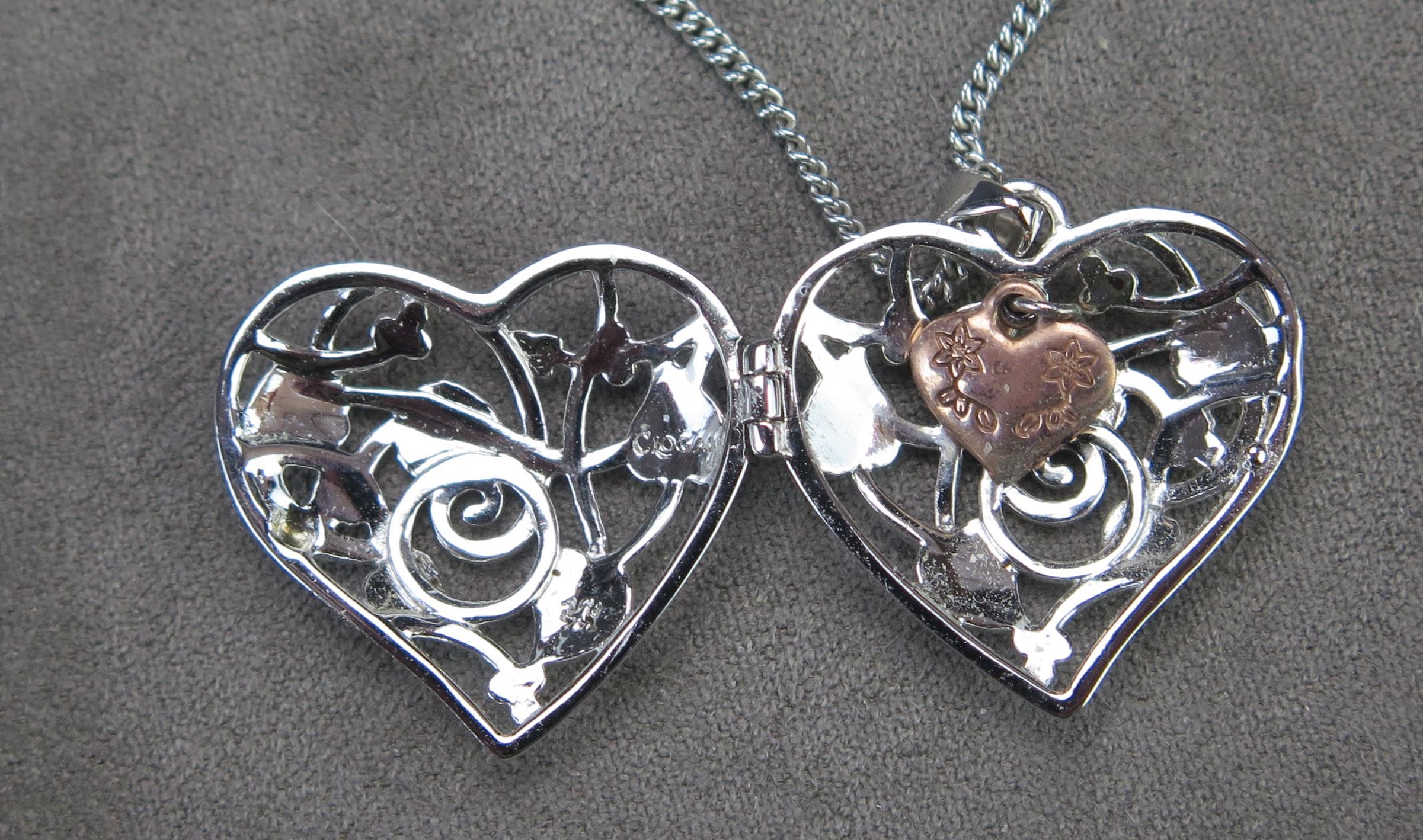 A Clogau Silver Heart Shaped Locket on chain with pierced foliate decoration and opening to reveal a - Image 2 of 2