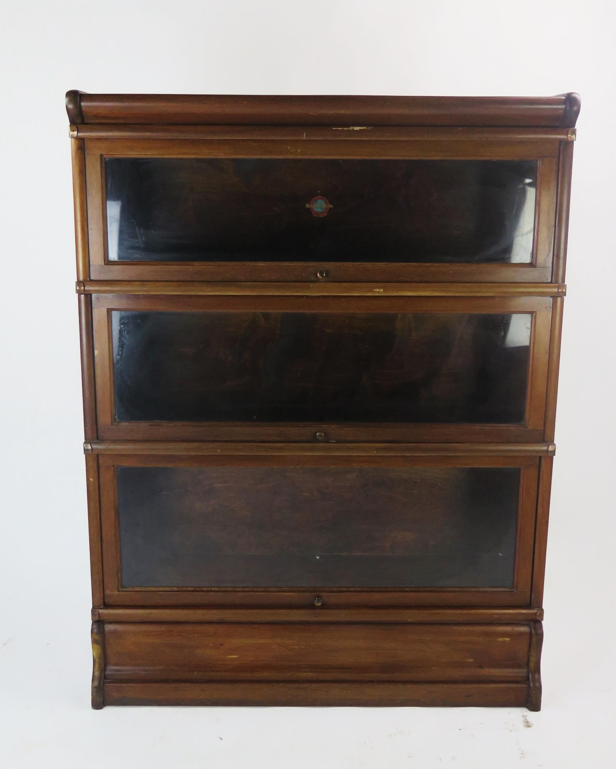 A Globe Wernicke Mahogany Three Tier Sectional Bookcase, 86(h)x26(d)x115(h)cm