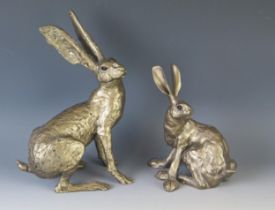 Two bronzed resin models of hares, 28cm and 20cm high. (2)