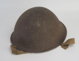 A British Mk III steel turtle helmet, with leather liner and canvas chin strap.