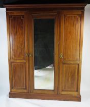 An Edwardian Mahogany and Strung Triple Wardrobe with a central mirror, 172(w)x56(d)x208(h)cm