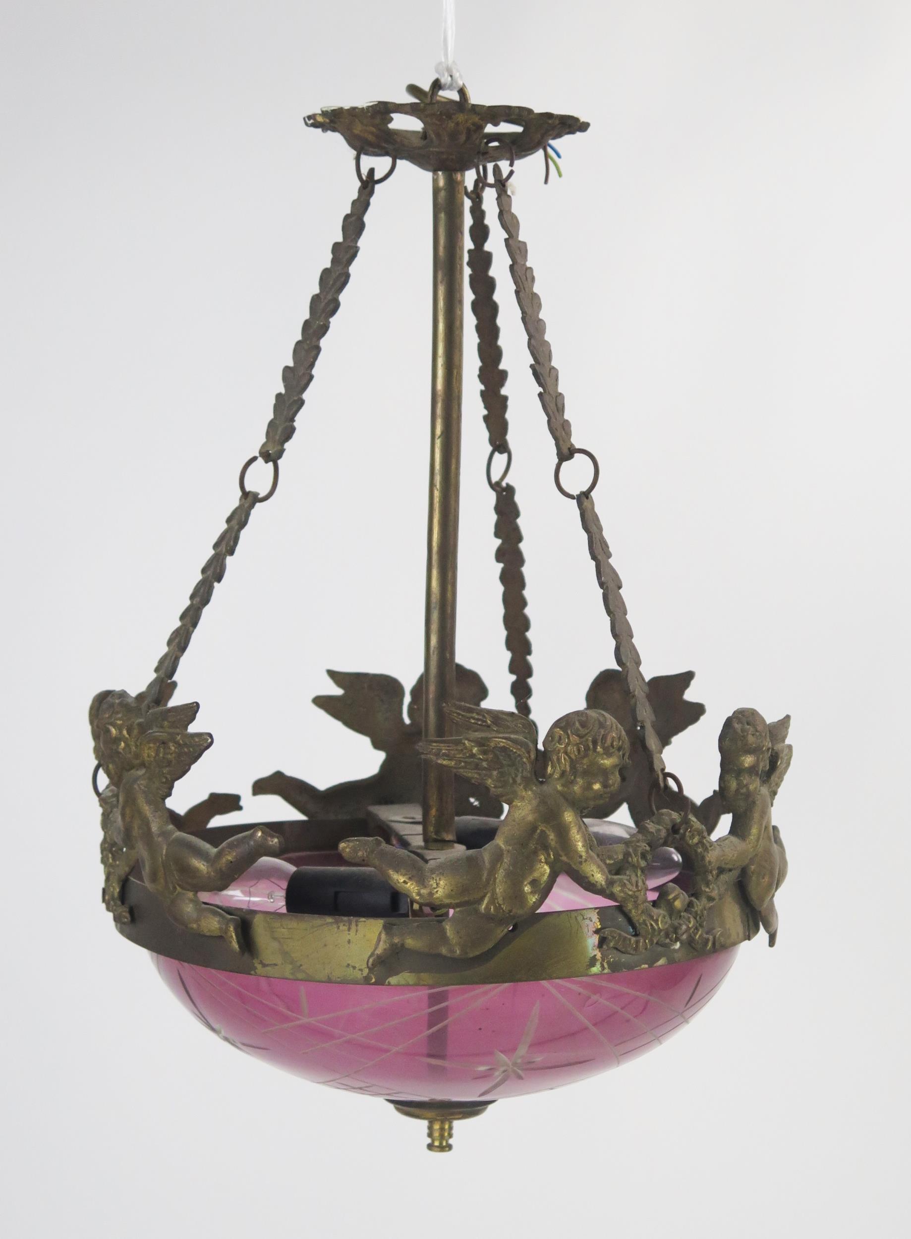 A Victorian purple glass and gilt metal mounted ceiling fitting, with pierced ceiling roe and