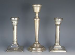 A pair of George III silver candlesticks, maker's marks worn possibly B&C, Birmingham, 1923, with