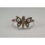 A Precious Yellow Metal and Seed Pearl or Cultured Seed Pearl Butterfly Ring, size M.5, KEE tests as