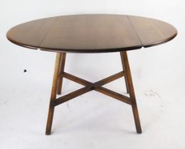 An Ercol Mid Oak Lap Table with cross stretcher, 113(w)x63-124(l)x73(h)cm