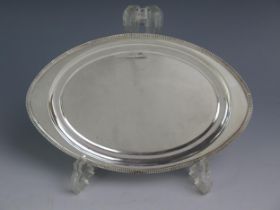 A George V silver tray, maker Roberts & Dore Ltd, Birmingham, 1934, of oval form with reeded border,