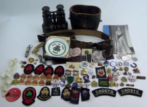 A Collection of Girl Guide Badges, two belts, a pair of 19th century binoculars, etc.