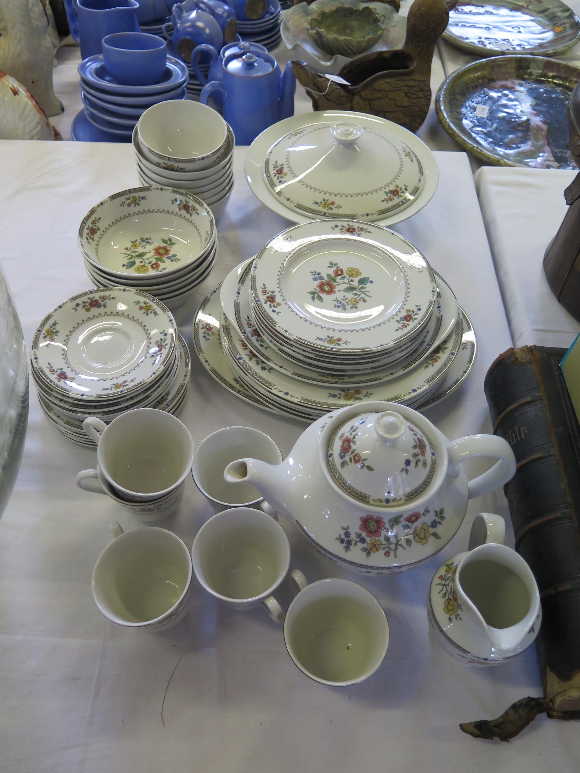 An extensive Royal Doulton "Kingswood" pattern tea and dinner service, includes meat dish, dinner