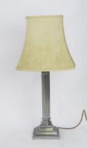 A plated table lamp, with reeded column on a stepped square base,