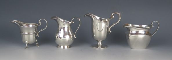 Four assorted silver cream jugs, various makers and dates, total weight of silver 292gms, 9.