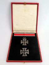 A Third Reich period cased Iron Cross 1st class and Iron Cross 2nd Class with ribbon, both stamped