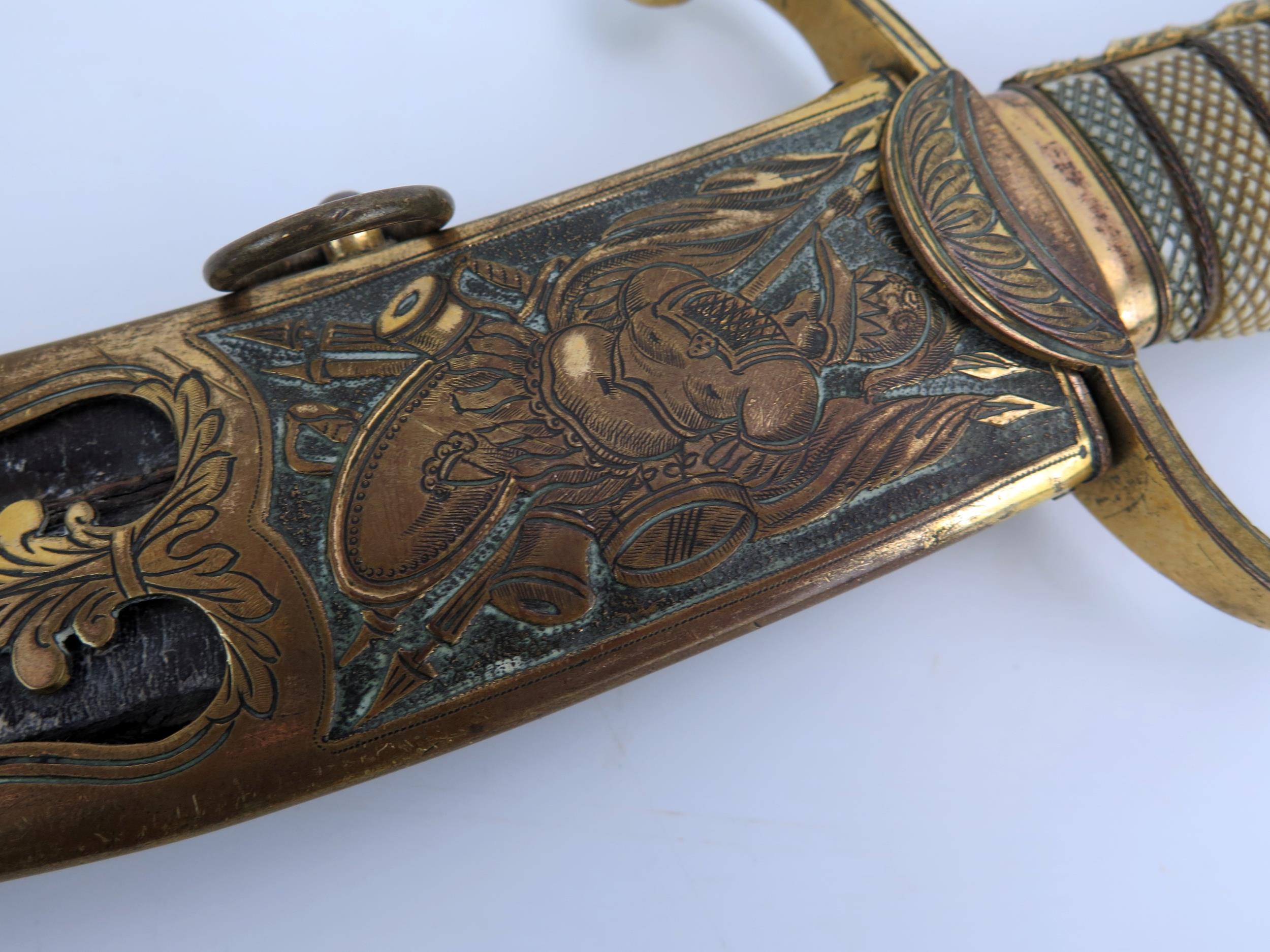 An early 19th century continental cutlass, with 44cm curved and etched blade, with gilt brass - Image 7 of 15