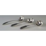 Three George III and later silver Fiddle pattern sauce ladles, various makers and dates, crested and