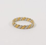 An 18 carat bi-colour gold twisted band, Sheffield 1988, finger size P, 5.1g CONDITION REPORTS &