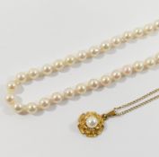 A string of individually knotted cultured pearls, the clasp stamped '375', 41cm long, and a 9