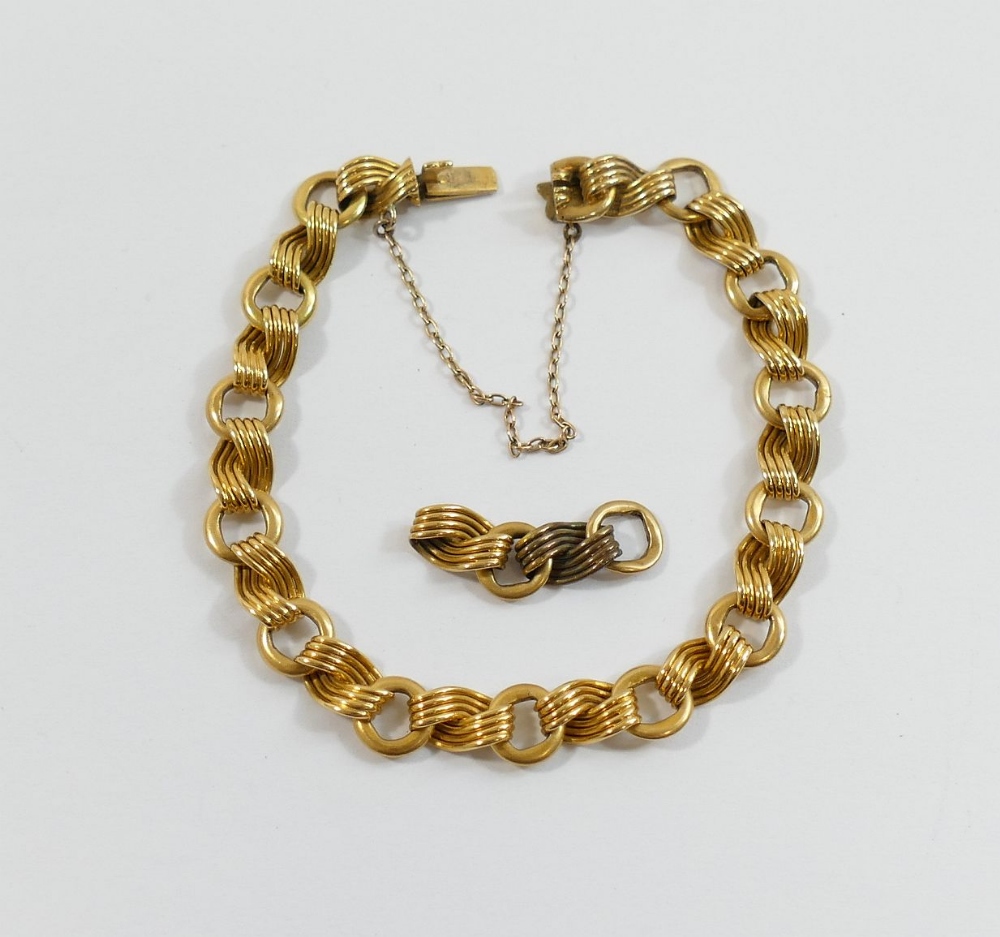 A Victorian fancy link bracelet, the box clasp stamped '18', the circular links alternated with