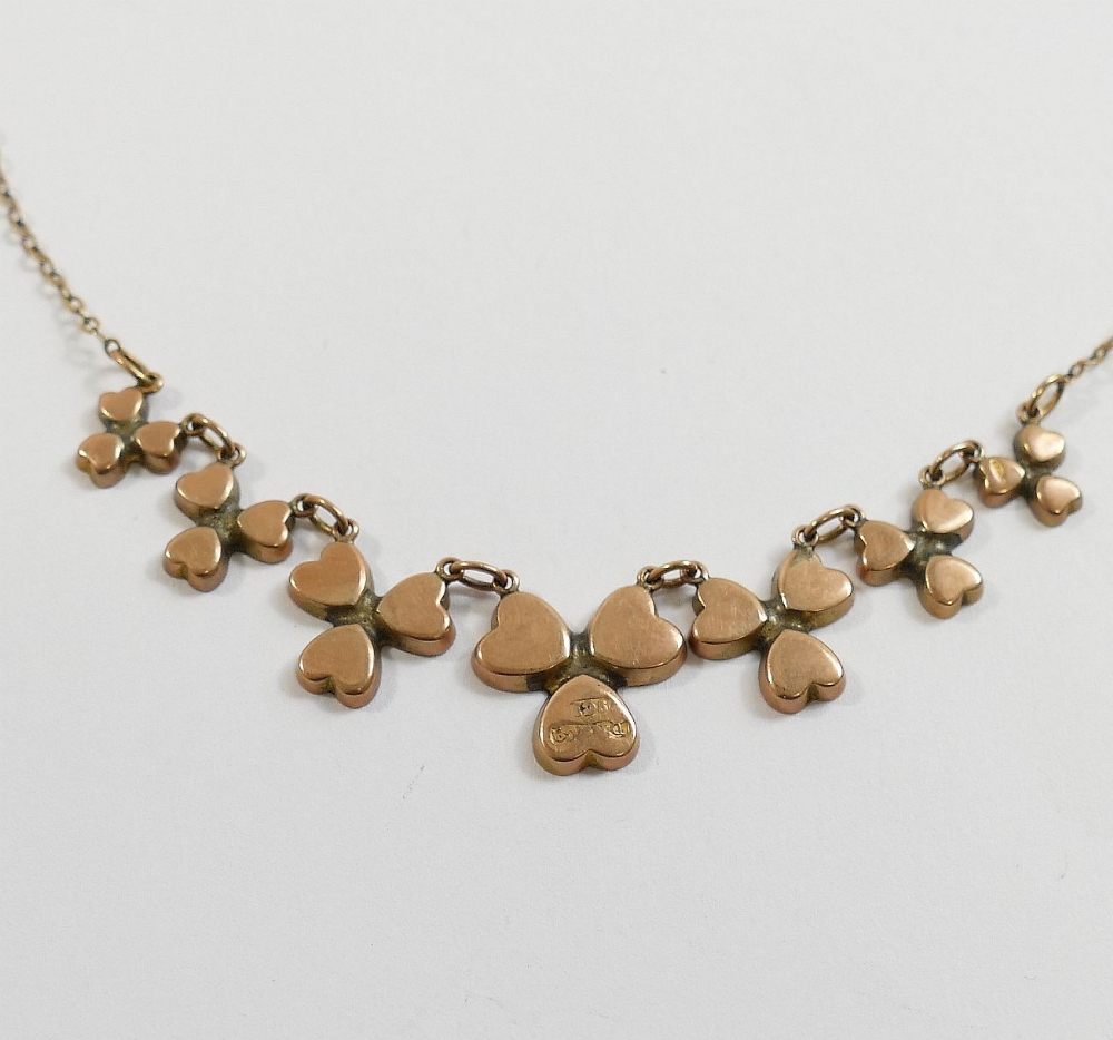 An Edwardian Connemara marble set shamrock necklace, the seven graduated shamrocks with closed - Image 3 of 3