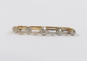 A diamond five-stone bar brooch, the centre old-cut stone approximately 0.50 carats, the remaining