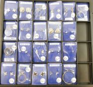 Twelve pairs of silver and silver coloured metal earrings including studs, hoops and clip-ons. Ex-